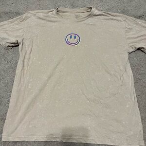 Super cute tan shirt with bright details. Worn once.